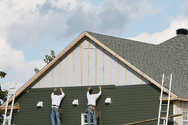 Professional Storm Damage Siding Repair technician working in Troutman, NC